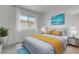 Comfortable bedroom with a large window, modern decor, and serene ambiance at 1101 Willow Tree Dr # D, Las Vegas, NV 89128