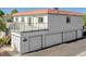 Exterior of a multi-level home with a balcony and multiple garages, offering ample parking at 1101 Willow Tree Dr # D, Las Vegas, NV 89128