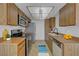 Functional kitchen with wood cabinets and modern appliances, perfect for culinary enthusiasts at 1101 Willow Tree Dr # D, Las Vegas, NV 89128