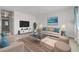 Bright living room with neutral tones, comfortable seating, and a modern entertainment center at 1101 Willow Tree Dr # D, Las Vegas, NV 89128