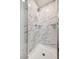 Modern shower with elegant marble walls, built-in shelving, and a sleek design at 1101 Willow Tree Dr # D, Las Vegas, NV 89128