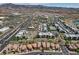 An aerial view showcasing an organized community with a mix of apartments, retail, and residential homes at 1425 Overseer Ave, Henderson, NV 89074