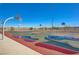 Community basketball court with multiple hoops for active play and friendly competition on a sunny day at 1425 Overseer Ave, Henderson, NV 89074