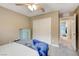 Comfortable bedroom featuring a ceiling fan and a door to the on-suite bathroom at 1425 Overseer Ave, Henderson, NV 89074