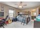 Bedroom featuring a bunk bed, desk, guitars, a ceiling fan, and view to the outside at 1425 Overseer Ave, Henderson, NV 89074