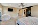 Bedroom with a sliding barn door, TV, and a closet visible through a doorway at 1425 Overseer Ave, Henderson, NV 89074
