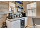 Unique coffee bar with custom shelving, stylish decor, a mini fridge and plenty of counter space at 1425 Overseer Ave, Henderson, NV 89074