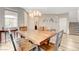 Well-lit dining area featuring wooden table and chairs, complete with chandelier at 1425 Overseer Ave, Henderson, NV 89074