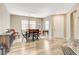 Neutral-toned dining area with wooden table set and plenty of natural light at 1425 Overseer Ave, Henderson, NV 89074