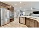 Spacious kitchen with stainless steel appliances, dark wood cabinets, and open floor plan at 1425 Overseer Ave, Henderson, NV 89074