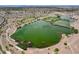 Scenic view of a lake with lush greenery, surrounded by trees and shrubs in a natural landscape at 1425 Overseer Ave, Henderson, NV 89074