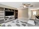 Upstairs living room boasting a large built-in shelving unit, ceiling fan and plush carpeting at 1425 Overseer Ave, Henderson, NV 89074