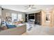 Spacious living room with built in shelving, a ceiling fan and plush carpeting at 1425 Overseer Ave, Henderson, NV 89074