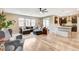 Spacious living room with modern sofa, open floor plan, and access to the kitchen at 1425 Overseer Ave, Henderson, NV 89074