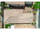 Aerial shot of a home's tiled rooftop, with landscaped yard, neighboring homes, and a glimpse of patio furniture at 1425 Overseer Ave, Henderson, NV 89074