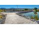 Scenic wooden walking path along the lake, offering beautiful views and a tranquil experience for community members at 1425 Overseer Ave, Henderson, NV 89074