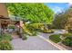 A beautifully landscaped backyard and brick patio at 2001 Silver Ave, Las Vegas, NV 89102