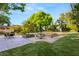 Large backyard with a putting green, a swimming pool with a slide, and a patio with seating at 2001 Silver Ave, Las Vegas, NV 89102