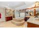Luxurious bathroom with a soaking tub, walk-in shower, dual vanities, and elegant finishes at 2001 Silver Ave, Las Vegas, NV 89102