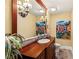 Well-lit bathroom with a wood vanity, decorative mirror, and modern fixtures at 2001 Silver Ave, Las Vegas, NV 89102