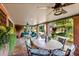 Inviting covered patio with ceiling fans, brick pillars, and views of the lush backyard at 2001 Silver Ave, Las Vegas, NV 89102