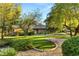Inviting brick home with a manicured lawn, mature trees, and charming landscaping in a serene setting at 2001 Silver Ave, Las Vegas, NV 89102