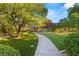 Beautifully landscaped front yard with a brick pathway leading to a classic brick home at 2001 Silver Ave, Las Vegas, NV 89102