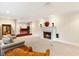 Spacious living room with a cozy fireplace and comfortable seating at 2001 Silver Ave, Las Vegas, NV 89102