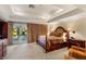 Tranquil main bedroom boasts a tray ceiling, sitting area, and private access to the backyard at 2001 Silver Ave, Las Vegas, NV 89102