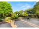 Beautiful backyard featuring a swimming pool, lush trees, and an outdoor dining area at 2001 Silver Ave, Las Vegas, NV 89102