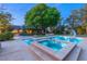 Backyard featuring a pristine pool and spa with beautiful landscaping and mature trees at 2001 Silver Ave, Las Vegas, NV 89102