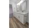 Modern bathroom with double vanity, marble countertop, and updated fixtures at 2711 Sesame Dr, Las Vegas, NV 89142