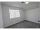 Bright bedroom with carpet, window, and neutral color palette at 2711 Sesame Dr, Las Vegas, NV 89142