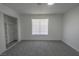 Bright bedroom with closet, window, and neutral carpet at 2711 Sesame Dr, Las Vegas, NV 89142