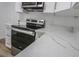 Close-up of a modern kitchen, stainless steel appliances, and beautiful marble countertops at 2711 Sesame Dr, Las Vegas, NV 89142