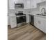 Bright kitchen featuring stainless steel appliances, white cabinetry, and marble countertops at 2711 Sesame Dr, Las Vegas, NV 89142