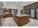 Spacious kitchen with wood cabinets, granite countertops, stainless steel appliances, and large island at 2925 Coast Line Ct, Las Vegas, NV 89117