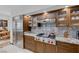 Gourmet kitchen featuring stainless steel appliances, granite countertops, and custom cabinetry at 2925 Coast Line Ct, Las Vegas, NV 89117