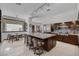 Open-concept kitchen with granite island, stainless steel appliances, and breakfast nook at 2925 Coast Line Ct, Las Vegas, NV 89117