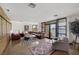 Inviting living room with water view, comfortable seating, and lots of natural light at 2925 Coast Line Ct, Las Vegas, NV 89117