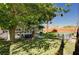 Serene backyard featuring lush green lawn, custom-built bar, and a cowboy pool for relaxation and entertaining at 3013 Roseville Way, Las Vegas, NV 89102