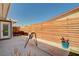 Cozy backyard patio with a modern horizontal wood fence and space for outdoor seating, perfect for entertaining at 3013 Roseville Way, Las Vegas, NV 89102