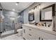 Modern bathroom with walk-in shower, dual sink vanity and contemporary fixtures at 3013 Roseville Way, Las Vegas, NV 89102
