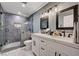 Modern bathroom with walk-in shower, dual sink vanity and contemporary fixtures at 3013 Roseville Way, Las Vegas, NV 89102