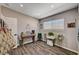 Bright bedroom with hardwood floors, recessed lights, and a window overlooking a green space at 3013 Roseville Way, Las Vegas, NV 89102