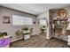 Bedroom featuring large window, closet, decor, and hardwood flooring at 3013 Roseville Way, Las Vegas, NV 89102