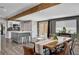 Bright dining area featuring a rustic wood table, gray walls, and modern finishes at 3013 Roseville Way, Las Vegas, NV 89102