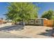 Charming home with a gravel front yard, mature tree, and long driveway at 3013 Roseville Way, Las Vegas, NV 89102