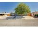 Charming single-story home with mature landscaping, a gravel front yard, and updated fence at 3013 Roseville Way, Las Vegas, NV 89102