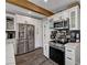 Modern kitchen featuring stainless steel appliances, white cabinets, and stylish backsplash at 3013 Roseville Way, Las Vegas, NV 89102